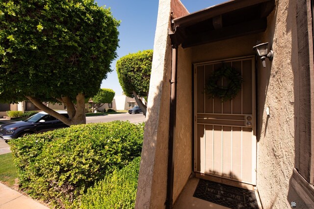 660 E 26th St, Yuma, AZ 85365 - doorway to property with stucco siding