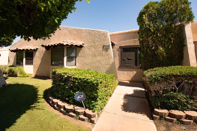 660 E 26th St, Yuma, AZ 85365 - view of front of house featuring a front yard and stucco siding