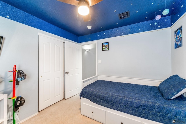 bedroom with carpet floors, baseboards, and visible vents