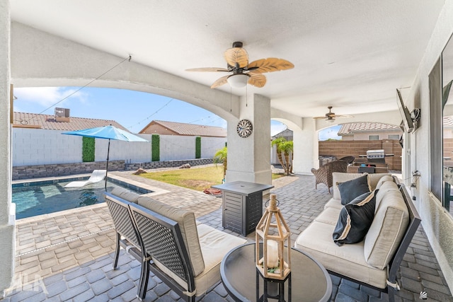 view of patio with a fenced backyard, a fenced in pool, ceiling fan, and an outdoor living space