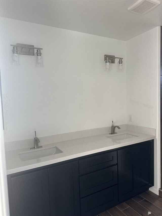 10864 E 45th St, Yuma, AZ 85367 - full bathroom with double vanity and wood finished floors