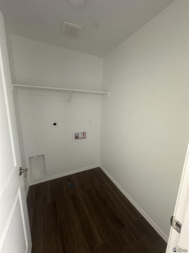 10864 E 45th St, Yuma, AZ 85367 - laundry room with dark wood-style floors, washer hookup, electric dryer hookup, and baseboards