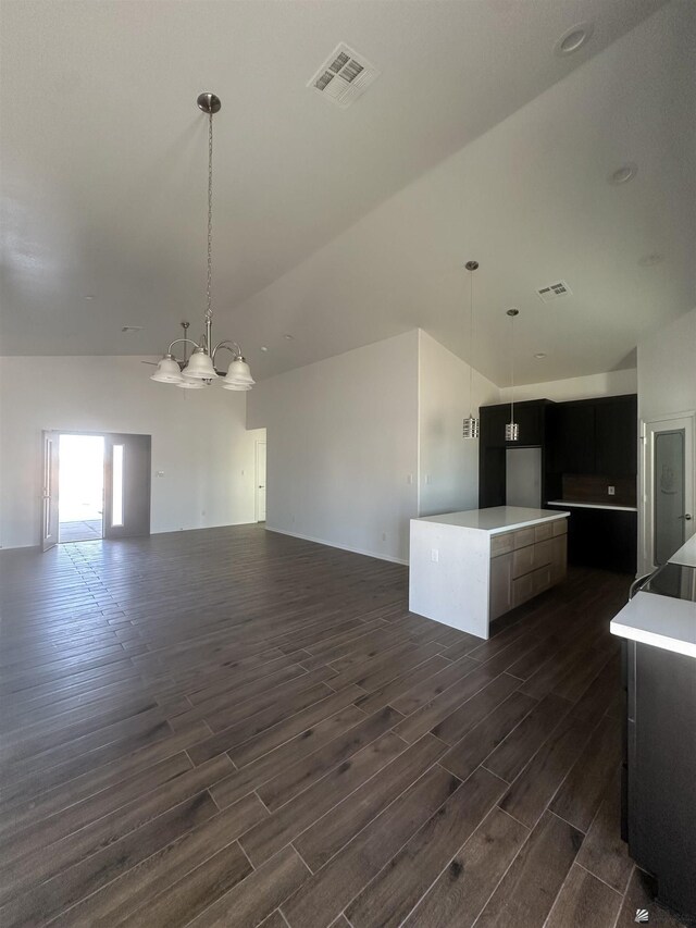 10864 E 45th St, Yuma, AZ 85367 - kitchen with dark wood-type flooring, lofted ceiling, open floor plan, and pendant lighting
