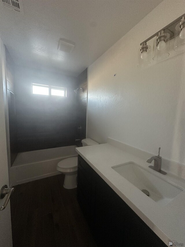 10864 E 45th St, Yuma, AZ 85367 - bathroom with vanity, bathing tub / shower combination, toilet, and wood finished floors