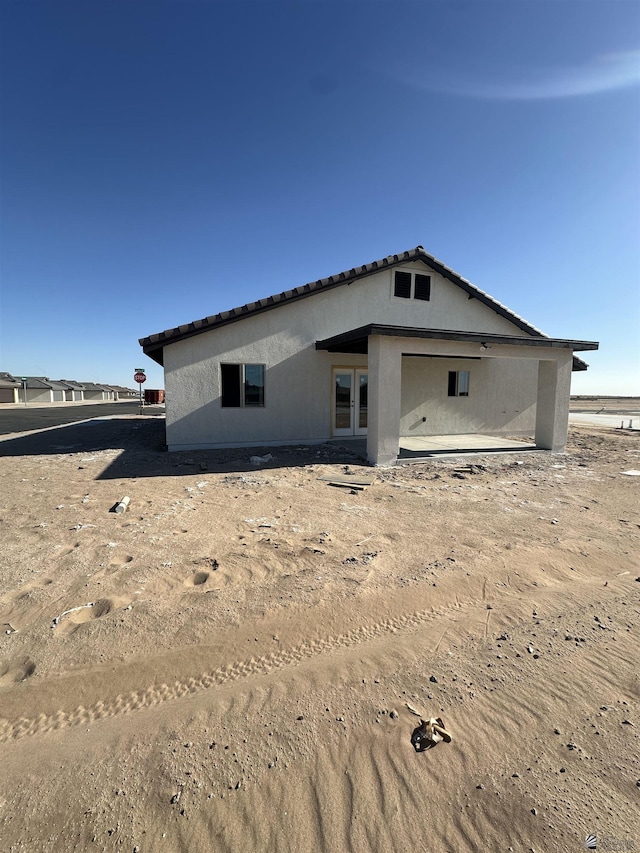 10864 E 45th St, Yuma, AZ 85367 - rear view of property with stucco siding and a tile roof