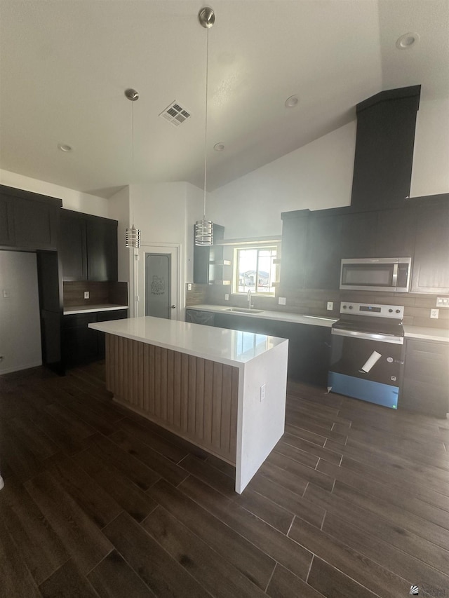 10864 E 45th St, Yuma, AZ 85367 - kitchen featuring appliances with stainless steel finishes, dark wood finished floors, a sink, a center island, and high vaulted ceiling
