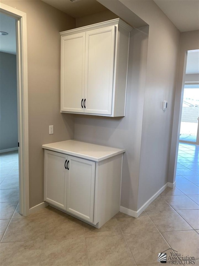 interior space featuring light tile patterned floors