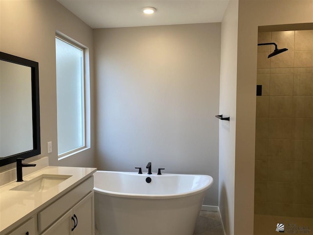 bathroom featuring tile patterned flooring, vanity, and independent shower and bath