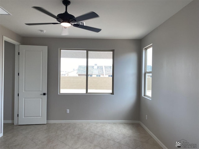 unfurnished room featuring ceiling fan