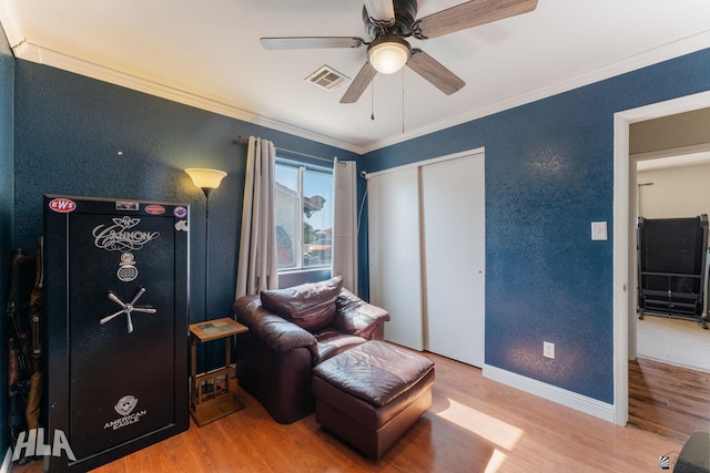 6248 E 42nd Ln, Yuma, AZ 85365 - living area featuring wood finished floors, ceiling fan, ornamental molding, and a textured wall