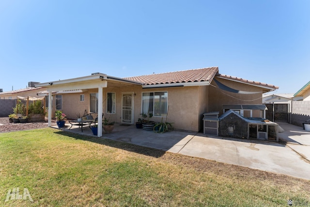 6248 E 42nd Ln, Yuma, AZ 85365 - back of property with a patio area, stucco siding, and a tiled roof