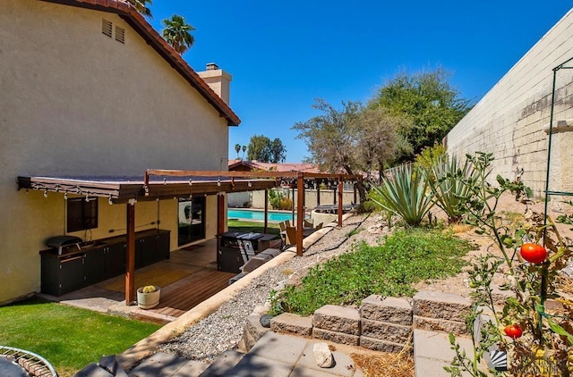view of yard featuring a fenced backyard, a fenced in pool, and a patio