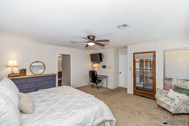 bedroom with carpet, a ceiling fan, and visible vents