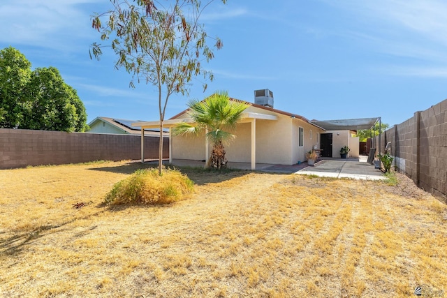 1086 S Arena Dr, Yuma, AZ 85364 - rear view of property with a patio area, a fenced backyard, and stucco siding