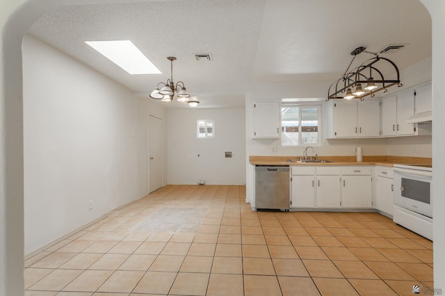 1086 S Arena Dr, Yuma, AZ 85364 - kitchen featuring stainless steel dishwasher, white range with electric cooktop, white cabinetry, and light countertops