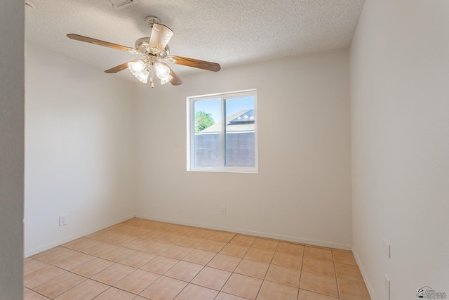 1086 S Arena Dr, Yuma, AZ 85364 - unfurnished room featuring a textured ceiling, ceiling fan, and light tile patterned flooring