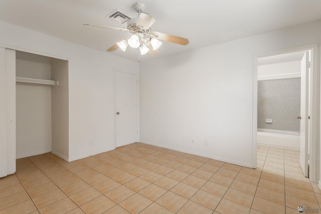 1086 S Arena Dr, Yuma, AZ 85364 - unfurnished bedroom with light tile patterned floors, a closet, and ceiling fan