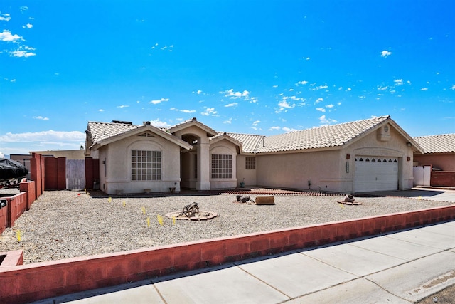 11595 S Prescott Ave, Yuma, AZ 85365 - view of front of home with stucco siding, a tiled roof, an attached garage, and driveway