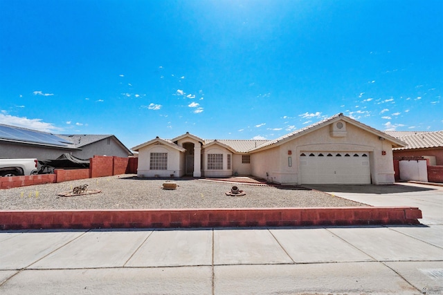 11595 S Prescott Ave, Yuma, AZ 85365 - view of front of property featuring a garage, concrete driveway, a tile roof, and stucco siding