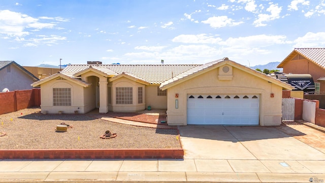 11595 S Prescott Ave, Yuma, AZ 85365 - view of front of house featuring stucco siding, concrete driveway, a tile roof, and a garage