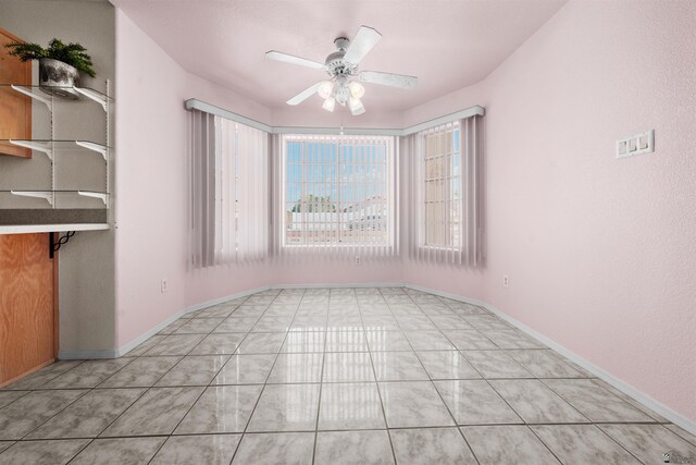 11595 S Prescott Ave, Yuma, AZ 85365 - empty room with a ceiling fan and light tile patterned floors