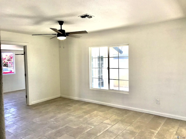 275 E 26th St, Yuma, AZ 85364 - unfurnished room with baseboards, a ceiling fan, and visible vents
