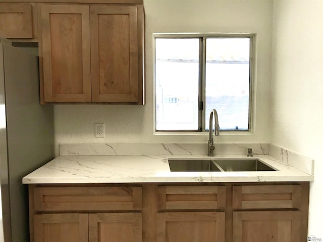 275 E 26th St, Yuma, AZ 85364 - kitchen featuring light stone countertops and a sink