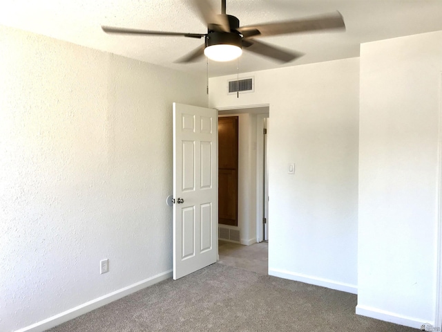 275 E 26th St, Yuma, AZ 85364 - unfurnished room with visible vents, a ceiling fan, baseboards, and light colored carpet