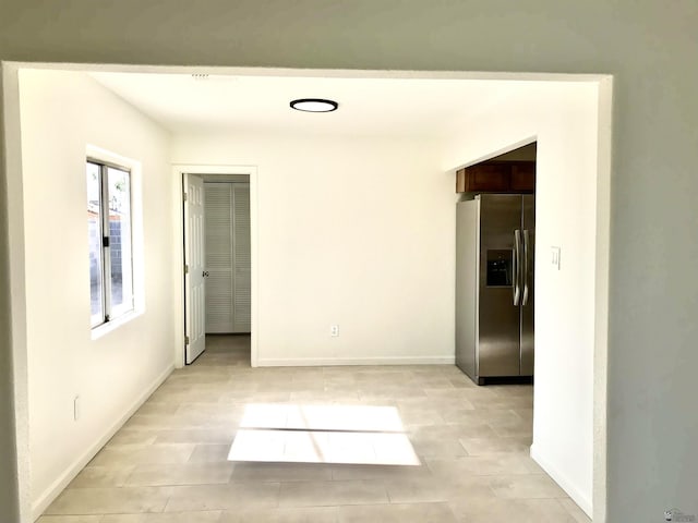 275 E 26th St, Yuma, AZ 85364 - unfurnished room with baseboards and light tile patterned floors