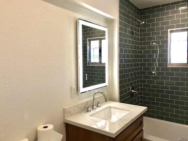 275 E 26th St, Yuma, AZ 85364 - bathroom featuring vanity, a textured wall, and  shower combination