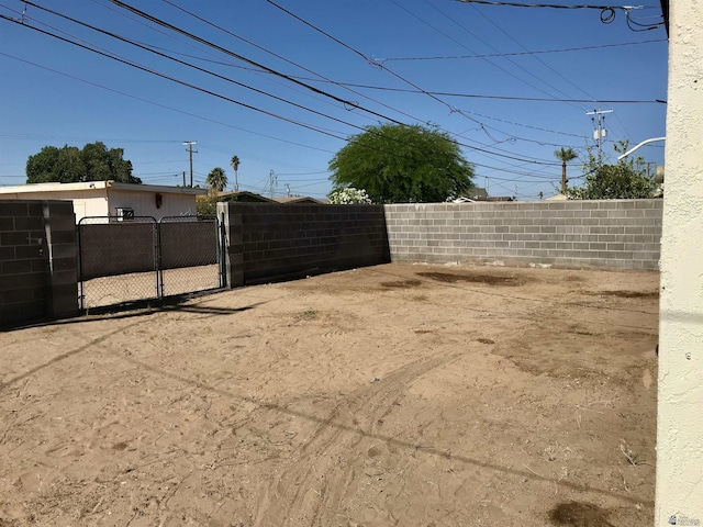 275 E 26th St, Yuma, AZ 85364 - view of yard featuring a gate and fence