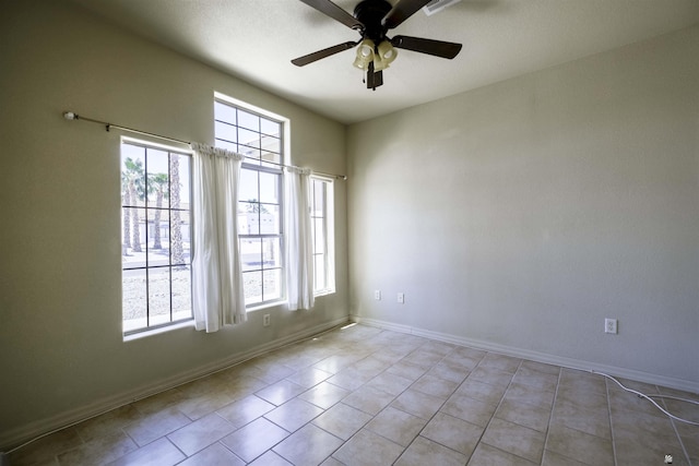 14158 E 49th Dr, Yuma, AZ 85367 - spare room featuring a healthy amount of sunlight, baseboards, and ceiling fan