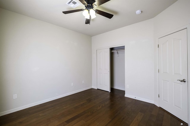 14158 E 49th Dr, Yuma, AZ 85367 - unfurnished bedroom with a ceiling fan, baseboards, visible vents, dark wood-style floors, and a closet
