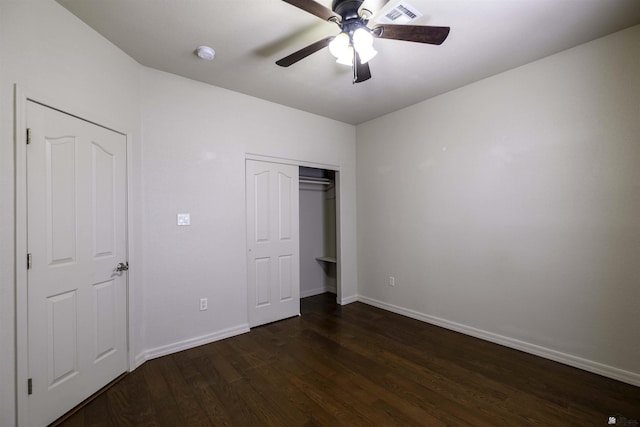 14158 E 49th Dr, Yuma, AZ 85367 - unfurnished bedroom with visible vents, a closet, baseboards, ceiling fan, and dark wood finished floors