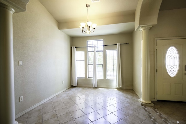 14158 E 49th Dr, Yuma, AZ 85367 - foyer with ornate columns, baseboards, and light tile patterned floors