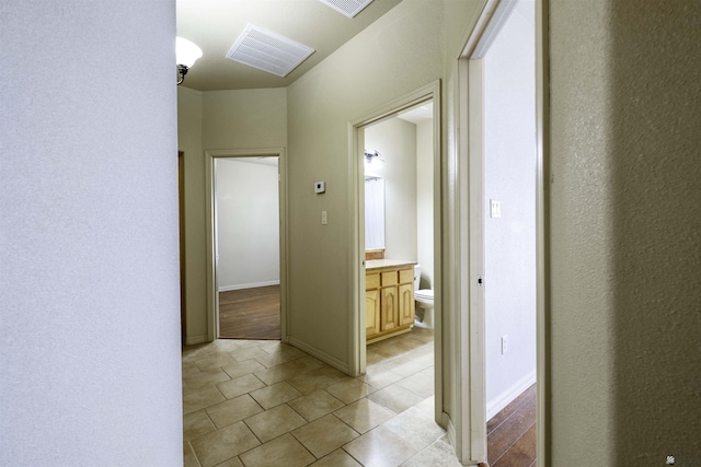 14158 E 49th Dr, Yuma, AZ 85367 - hallway with visible vents, baseboards, and light tile patterned floors
