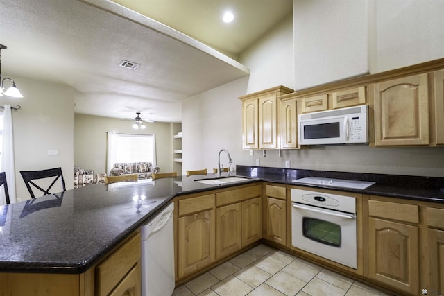 14158 E 49th Dr, Yuma, AZ 85367 - kitchen with visible vents, a sink, light tile patterned floors, a peninsula, and white appliances