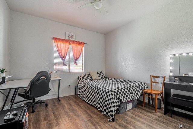 14307 E 49th Ln, Yuma, AZ 85367 - bedroom with ceiling fan, baseboards, a textured wall, and wood finished floors
