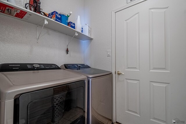 14307 E 49th Ln, Yuma, AZ 85367 - washroom with a textured wall, laundry area, and washing machine and clothes dryer