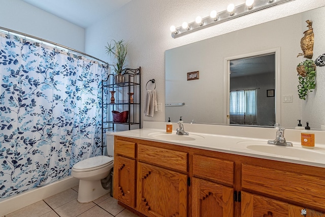 14307 E 49th Ln, Yuma, AZ 85367 - bathroom with a sink, tile patterned flooring, toilet, and double vanity