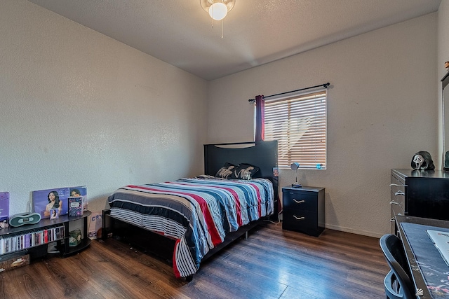 14307 E 49th Ln, Yuma, AZ 85367 - bedroom with baseboards, a textured wall, and wood finished floors