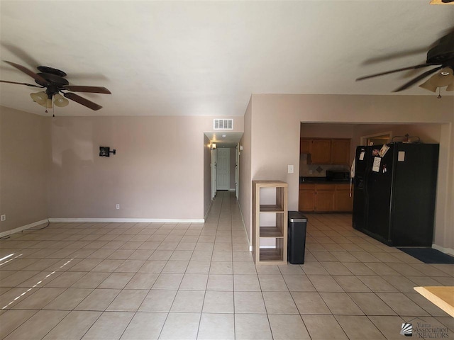2082 E Ln Mesa St, Yuma, AZ 85365 - unfurnished living room featuring baseboards, ceiling fan, visible vents, and light tile patterned floors