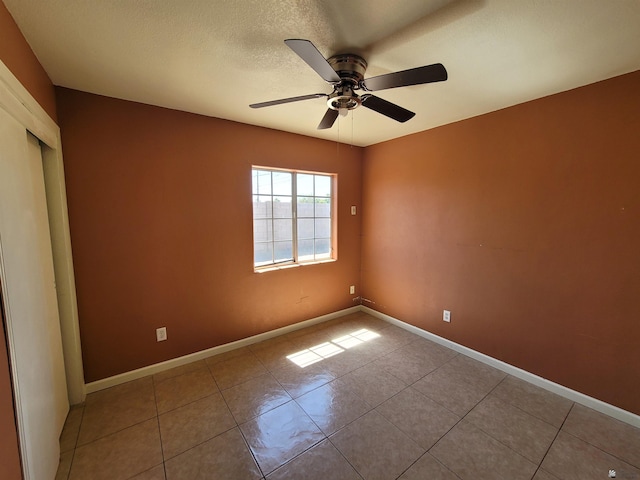 2082 E Ln Mesa St, Yuma, AZ 85365 - unfurnished bedroom with tile patterned floors, ceiling fan, and a closet