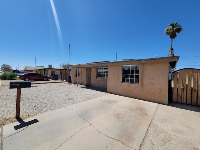 2082 E Ln Mesa St, Yuma, AZ 85365 - view of front facade with stucco siding and a gate