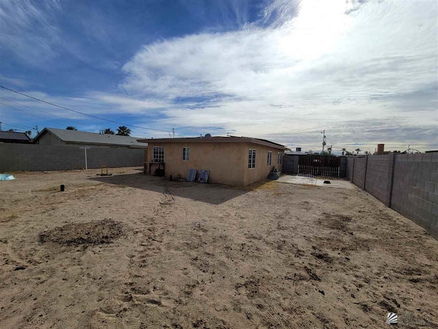 2082 E Ln Mesa St, Yuma, AZ 85365 - back of property featuring a fenced backyard and stucco siding