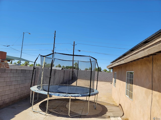 2082 E Ln Mesa St, Yuma, AZ 85365 - fenced backyard featuring a trampoline