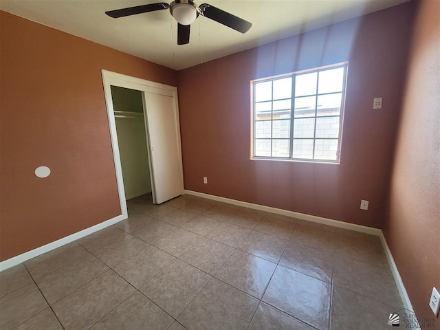 2082 E Ln Mesa St, Yuma, AZ 85365 - unfurnished bedroom featuring baseboards, ceiling fan, tile patterned flooring, and a closet