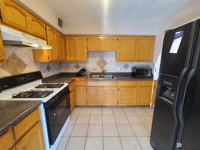 2082 E Ln Mesa St, Yuma, AZ 85365 - kitchen with a sink, gas stove, stainless steel microwave, visible vents, and black fridge with ice dispenser