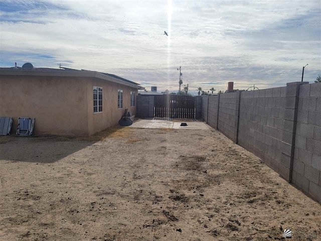 2082 E Ln Mesa St, Yuma, AZ 85365 - view of yard with fence and a gate