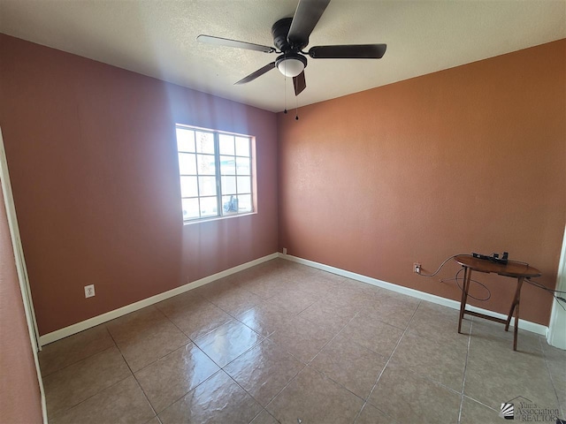 2082 E Ln Mesa St, Yuma, AZ 85365 - tiled empty room featuring a textured ceiling, ceiling fan, and baseboards